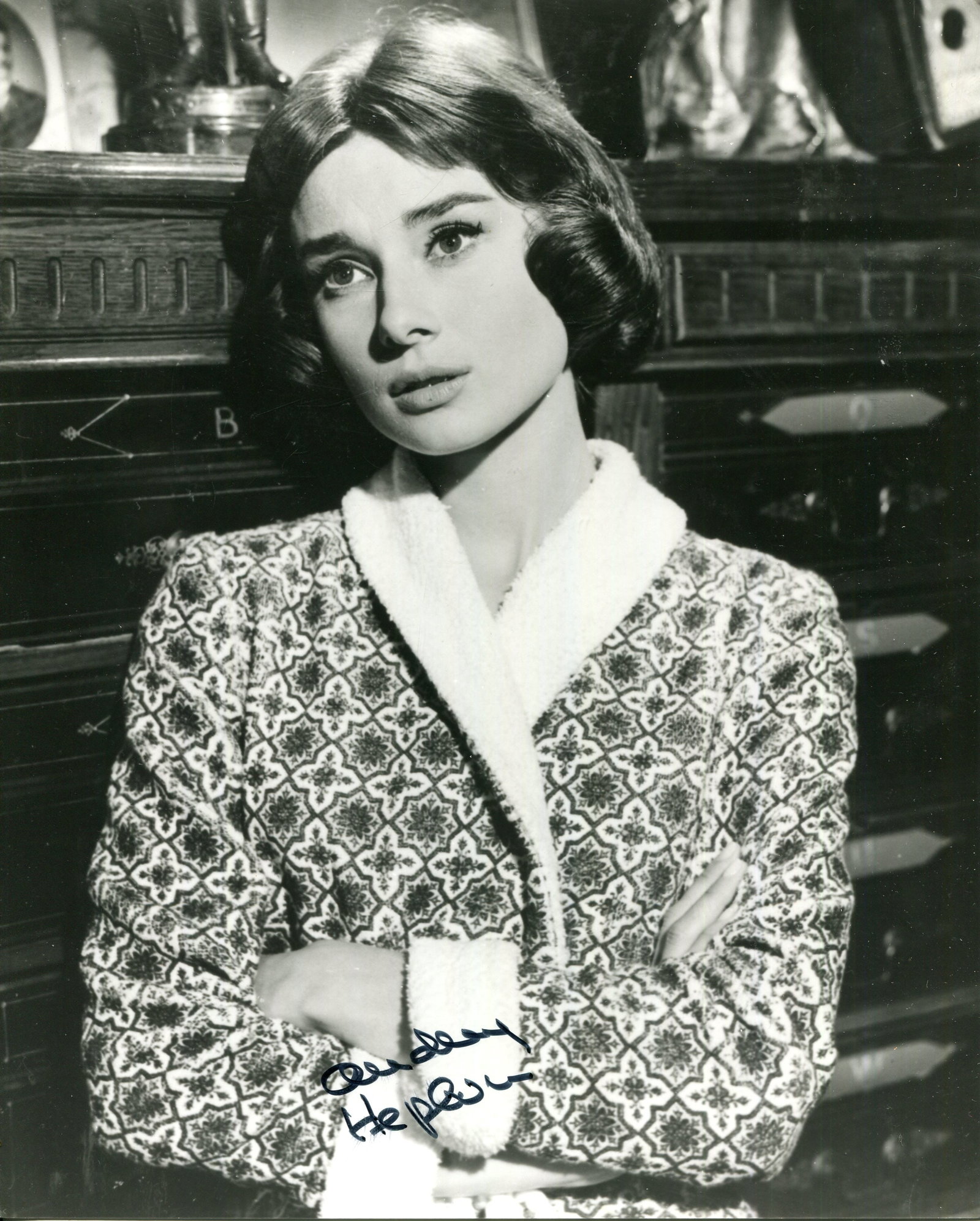 HEPBURN AUDREY: (1929-1993): HEPBURN AUDREY: (1929-1993) Belgian-born actress, Academy Award winner for Best Actress in 1953 for her role as Princess Ann in Roman Holiday. Signed 8 x 10 photograph of the actress standing in a