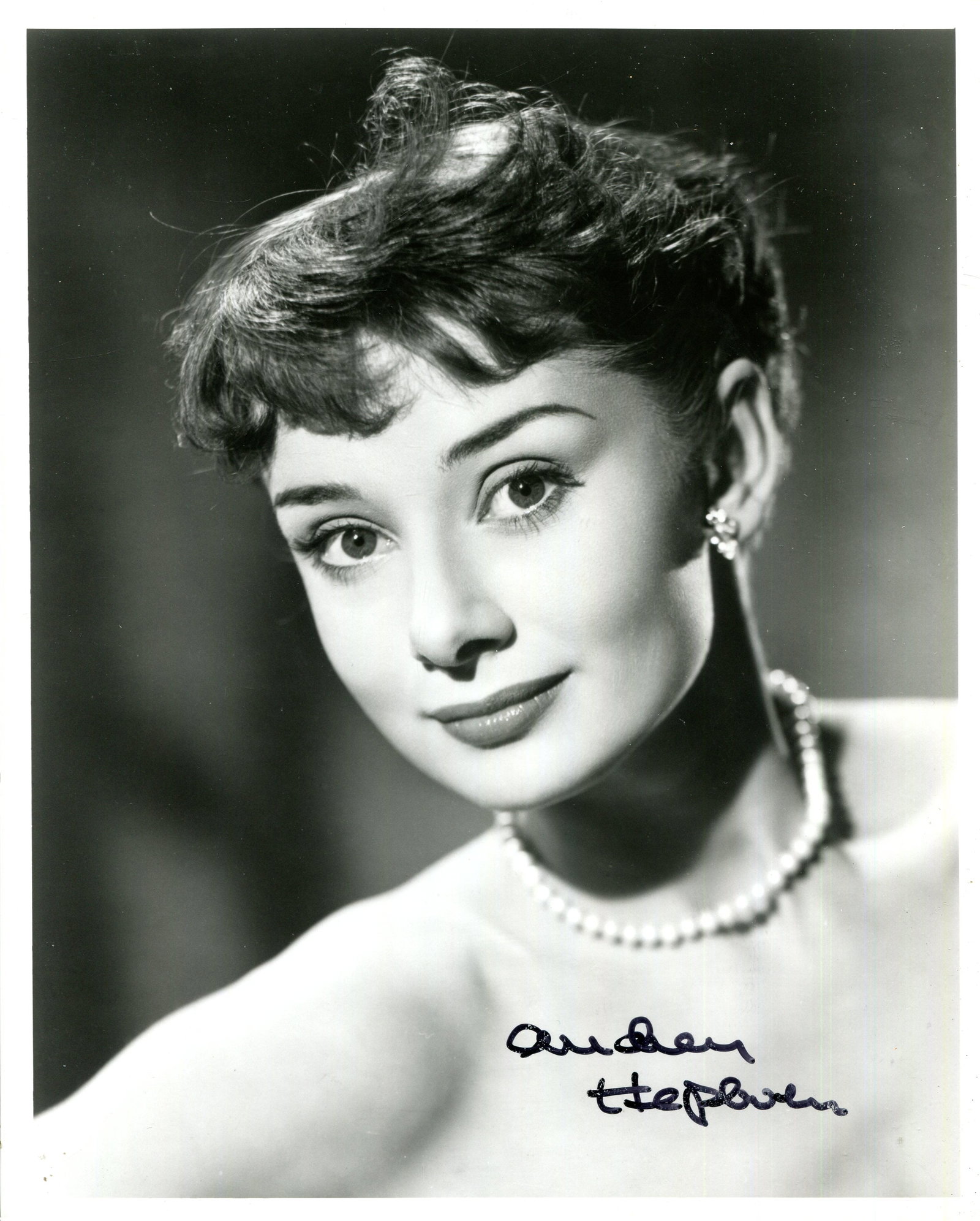 HEPBURN AUDREY: (1929-1993): HEPBURN AUDREY: (1929-1993) Belgian-born actress, Academy Award winner for Best Actress in 1953 for her role as Princess Ann in Roman Holiday. A good signed 8 x 10 photograph of the young actress in