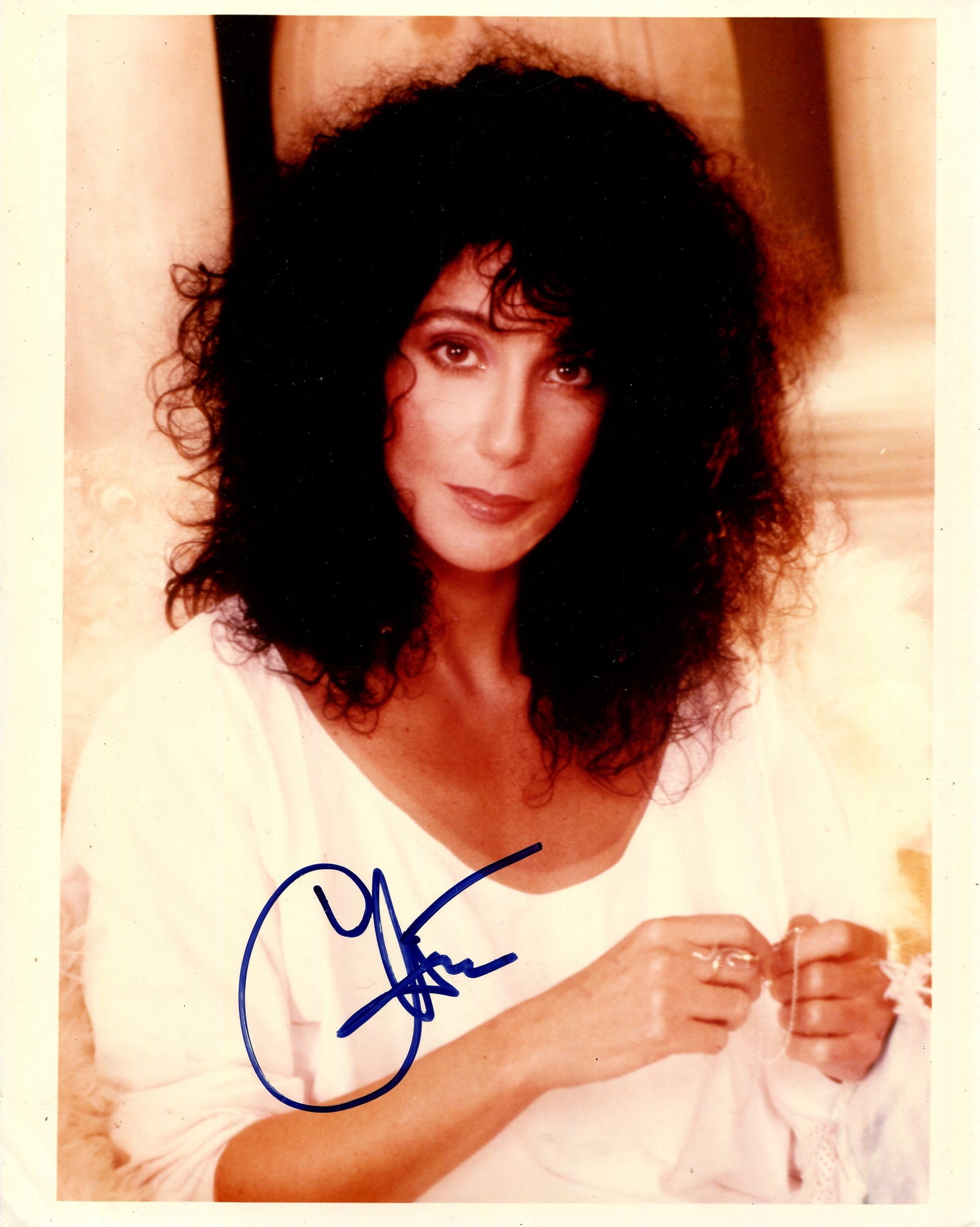 CHER: (1946- ): CHER: (1946- ) American singer and actress, Academy Award winner for Best Actress in 1987 for her role as Loretta Castorini in Moonstruck. Signed colour 8 x 10 photograph of Cher in a half-length