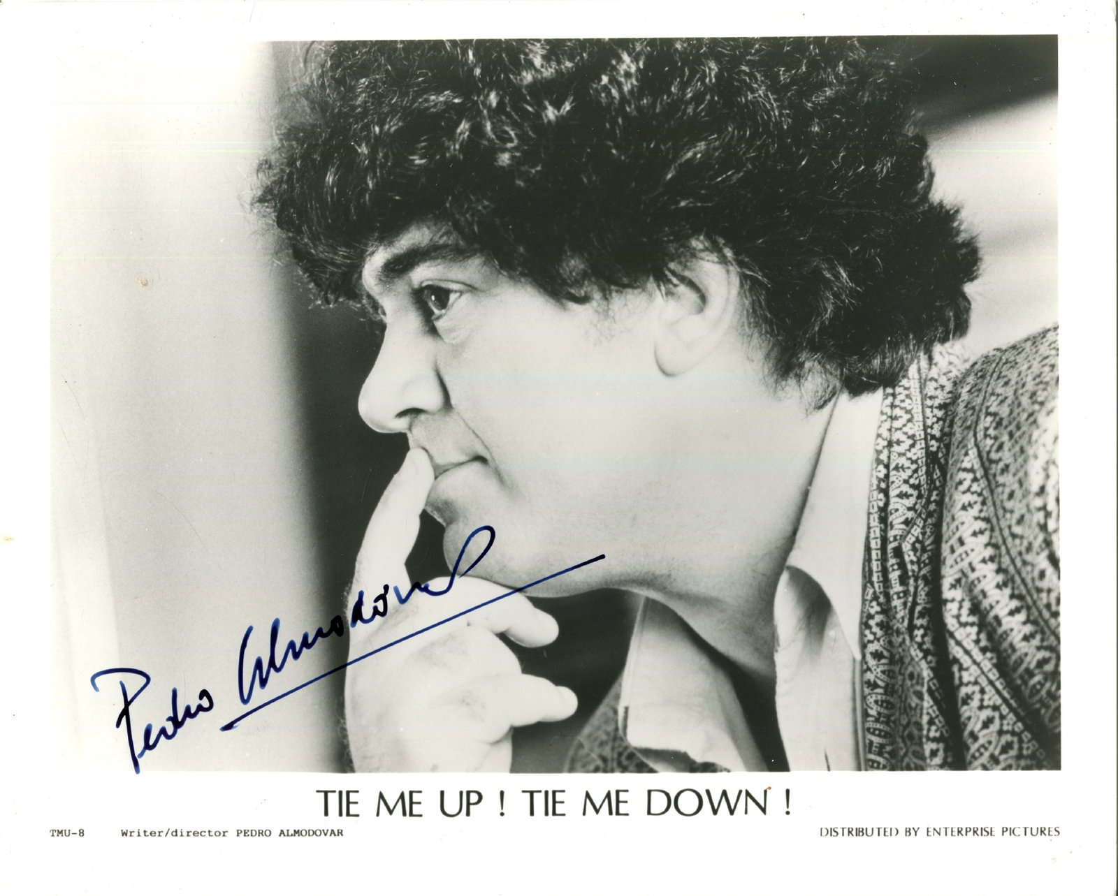 ALMODOVAR PEDRO: (1949- ): ALMODOVAR PEDRO: (1949- ) Spanish film director, Academy Award winner. Signed 10 x 8 photograph of Almodovar in a close-up profile pose with one finger raised to his lips, the publicity portrait