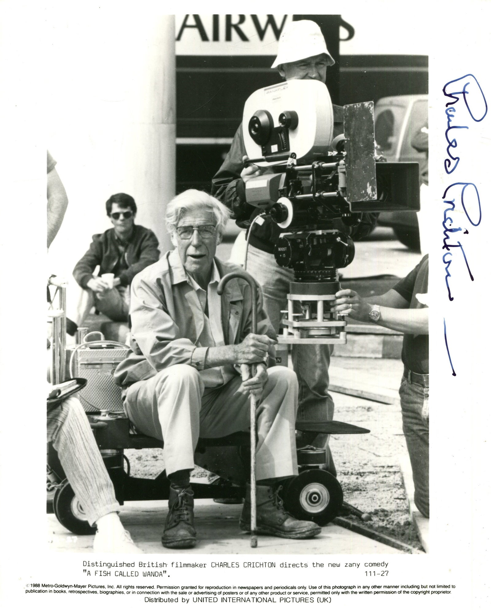 CRICHTON CHARLES: (1910-1999): CRICHTON CHARLES: (1910-1999) English film director, an Academy Award nominee. Signed 8 x 10 photograph of Crichton seated outdoors in a full-length pose, alongside a camera, on the set of his final