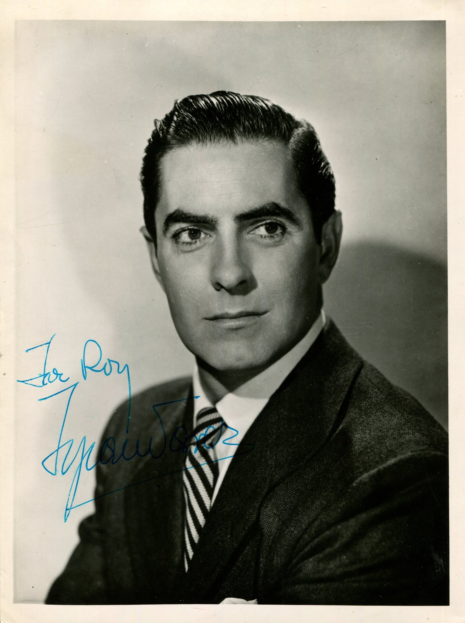 POWER TYRONE: (1914-1958): POWER TYRONE: (1914-1958) American actor. Vintage signed and inscribed 6 x 8 photograph of the handsome actor in a head and shoulders pose. Signed in turquoise fountain pen ink to the image. VG