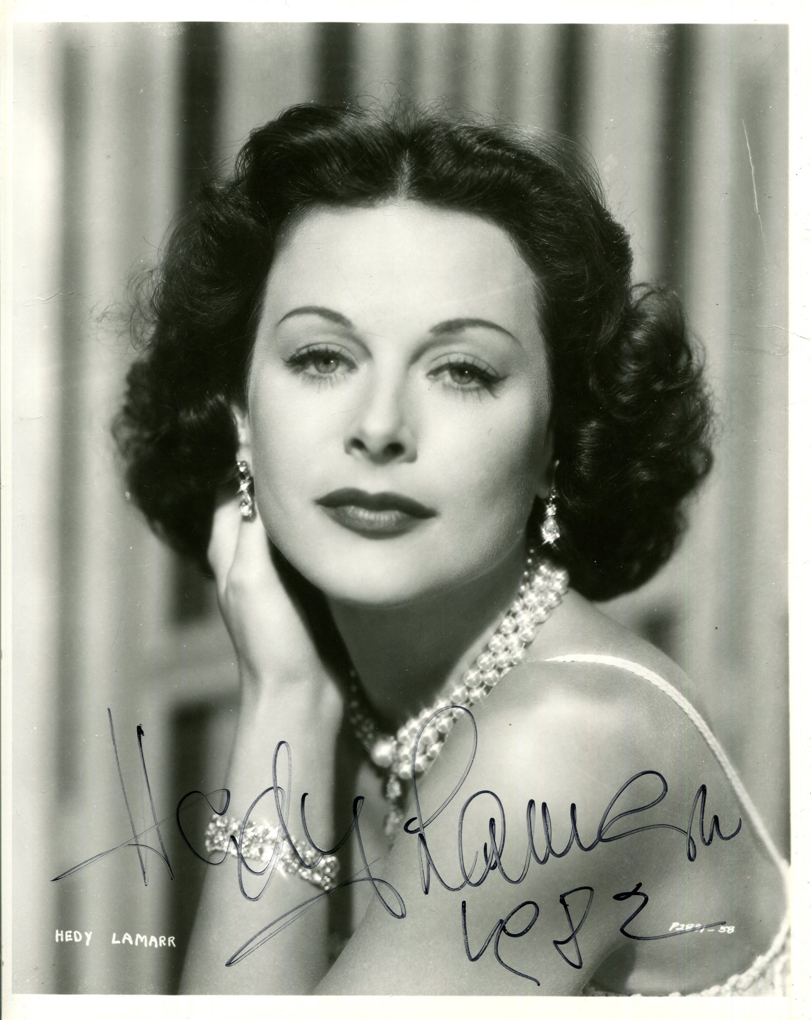 LAMARR HEDY: (1914-2000): LAMARR HEDY: (1914-2000) Austro-Hungarian-born American actress. Signed 8 x 10 photograph of the actress in an appealing head and shoulders pose with one hand gently raised to her neck, in costume as