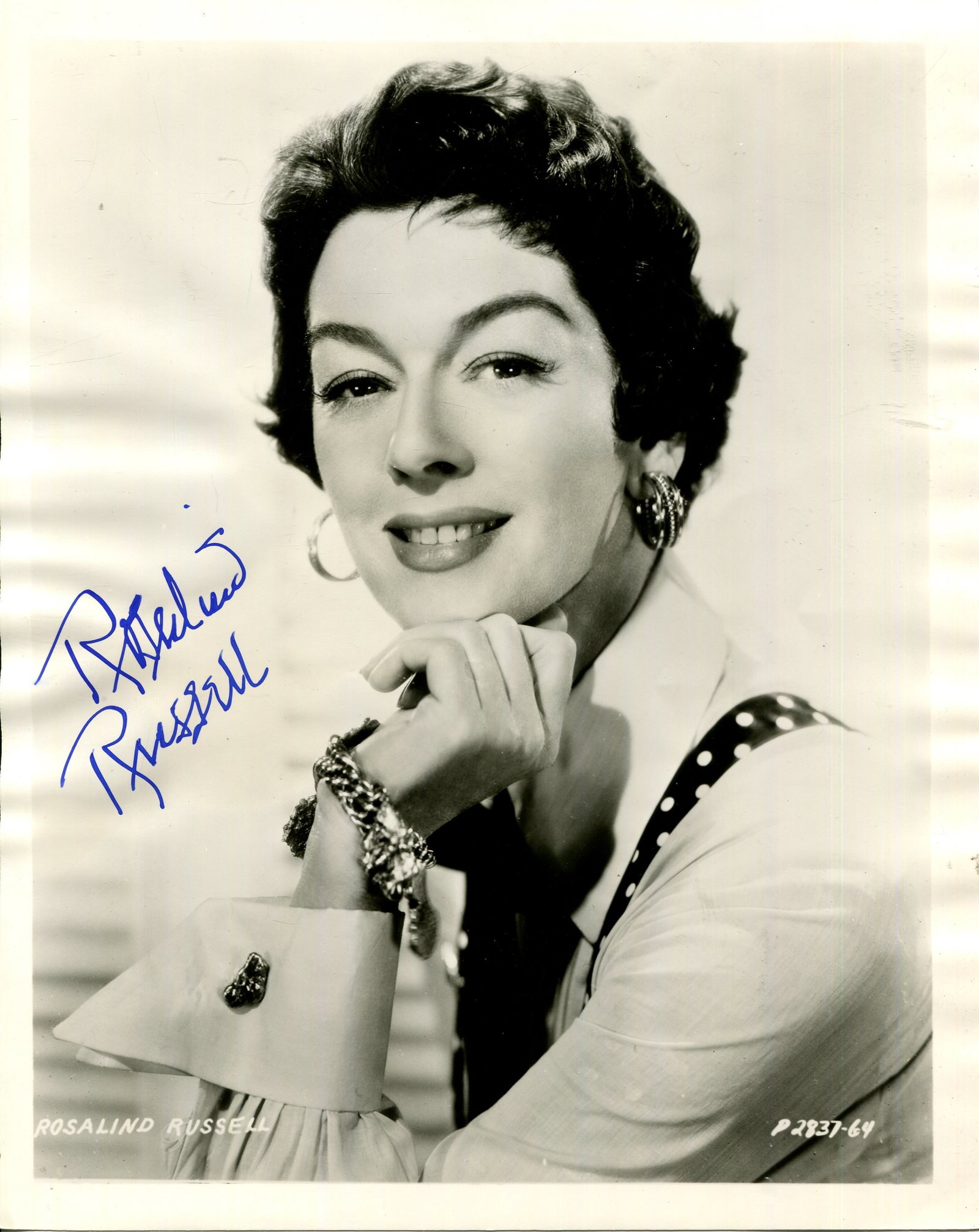 RUSSELL ROSALIND: (1907-1976): RUSSELL ROSALIND: (1907-1976) American actress, an Academy Award nominee for Best Actress on four occasions, in 1942, 1946, 1947 & 1958. Vintage signed 8 x 10 photograph of the actress in a smiling