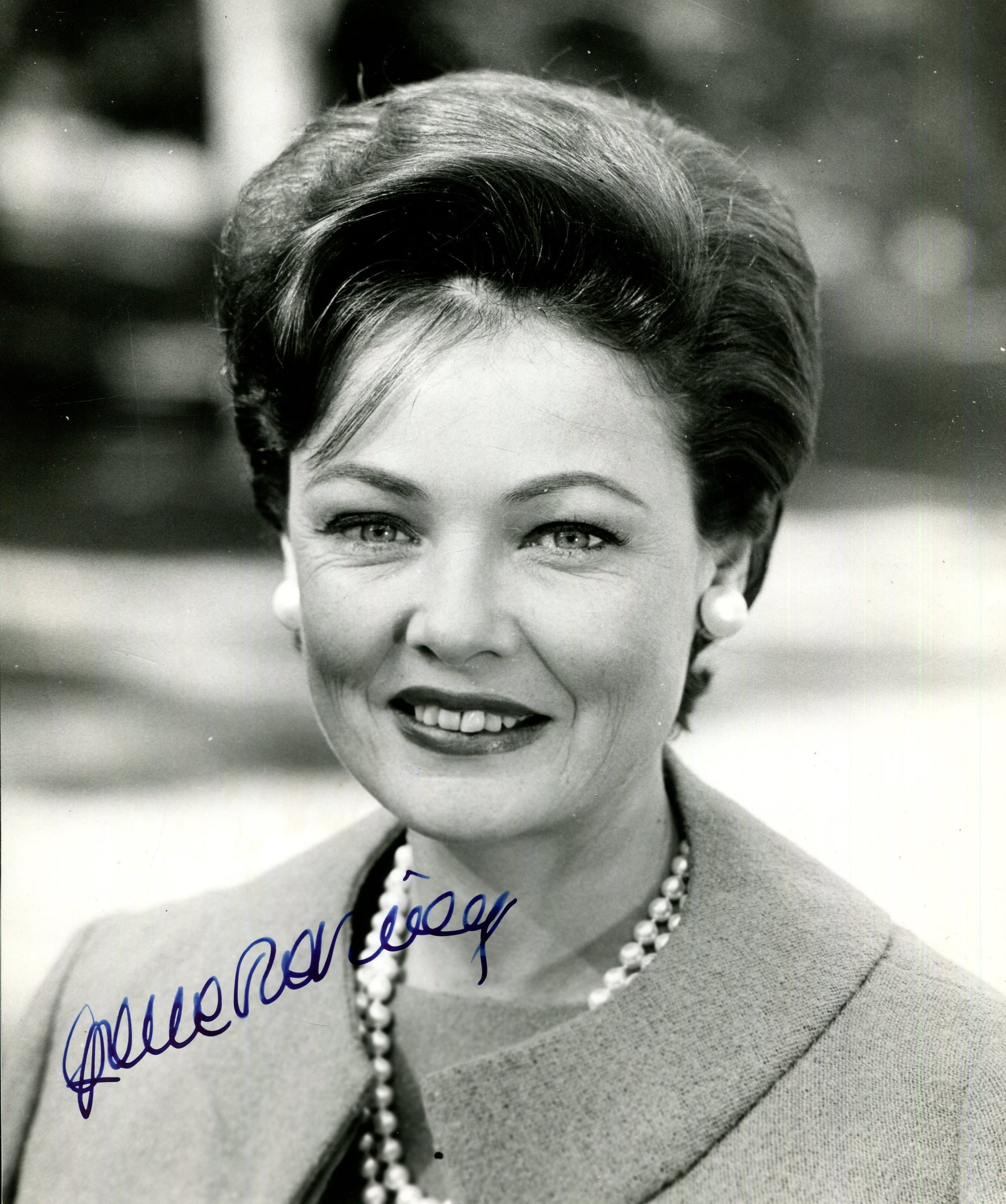 TIERNEY GENE: (1920-1991): TIERNEY GENE: (1920-1991) American actress. Signed 7.5 x 9 photograph of Tierney in a smiling head and shoulders pose. Signed in bold, dark blue fountain pen ink with her name alone across a lighter