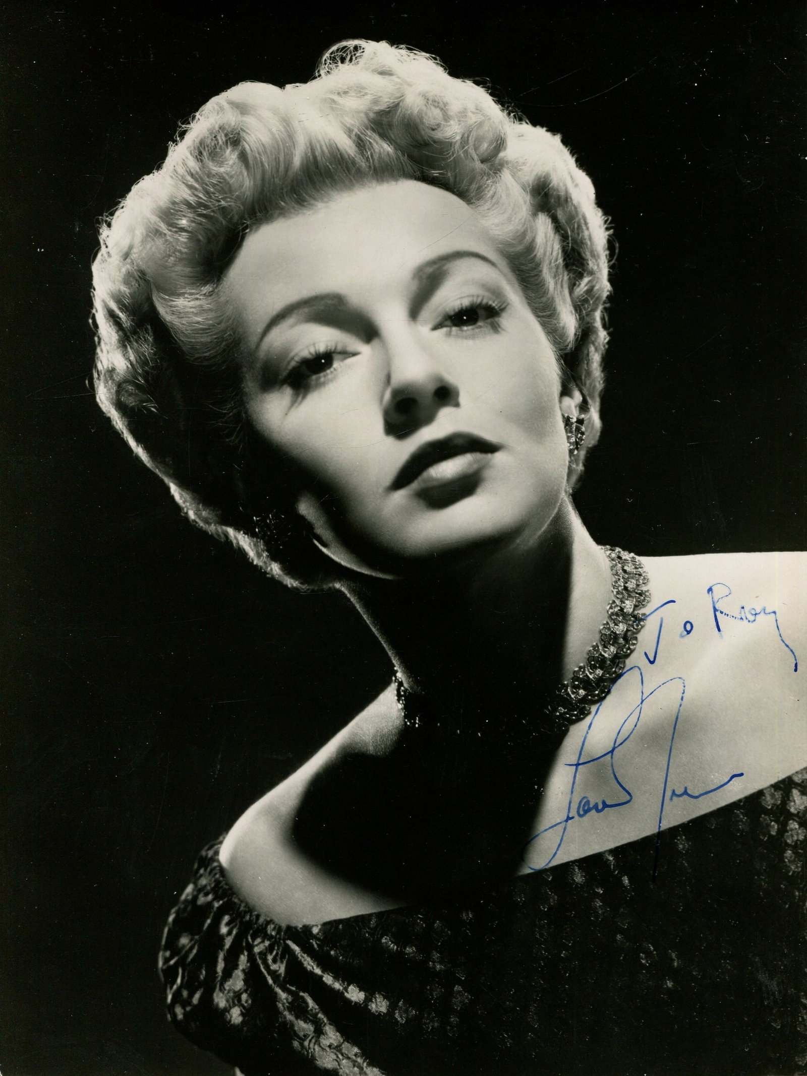 TURNER LANA: (1921-1995): TURNER LANA: (1921-1995) American actress. Vintage signed and inscribed 6 x 8 photograph of the actress in a head and shoulders pose. Signed in blue fountain pen ink across a lighter area of the