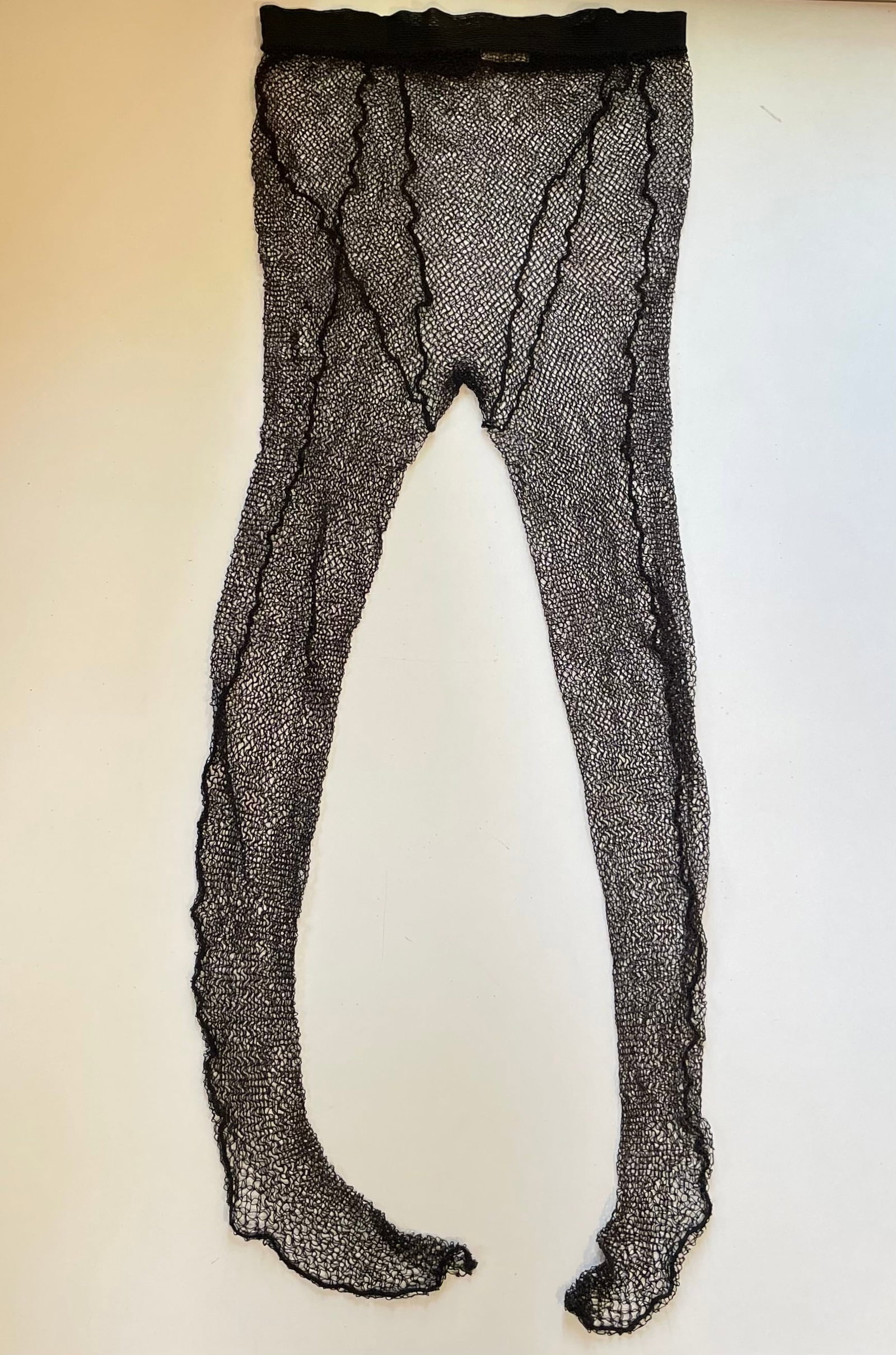 [MONROE MARILYN]: (1926-1962) Marilyn´ s screen-worn fishnet tights from Bus Stop: [MONROE MARILYN]: (1926-1962) American actress & sex symbol. A vintage pair of black fishnet tights, with a back seam, worn by Marilyn Monroe for her performance as the aspiring café chanteuse
