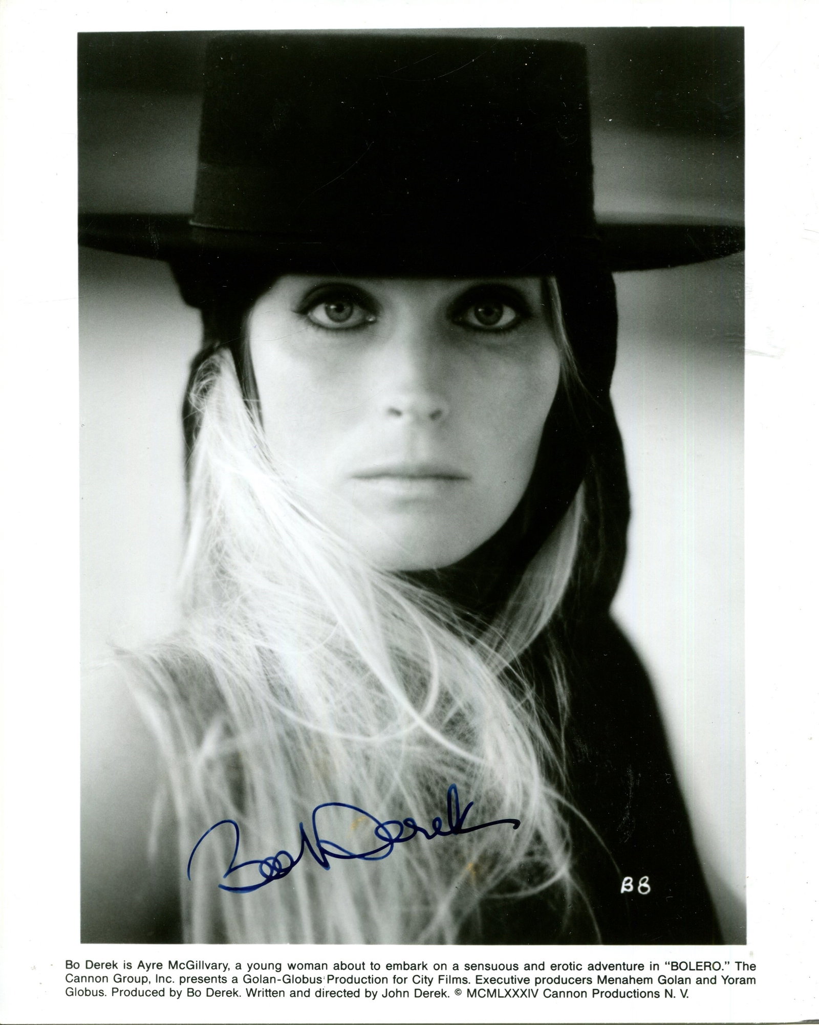 DEREK BO: (1956- ): DEREK BO: (1956- ) American actress & model. Signed 8 x 10 photograph of Derek in a captivating head and shoulders pose, wearing a black hat, in costume as the orphan heiress Ayre ´Mac´