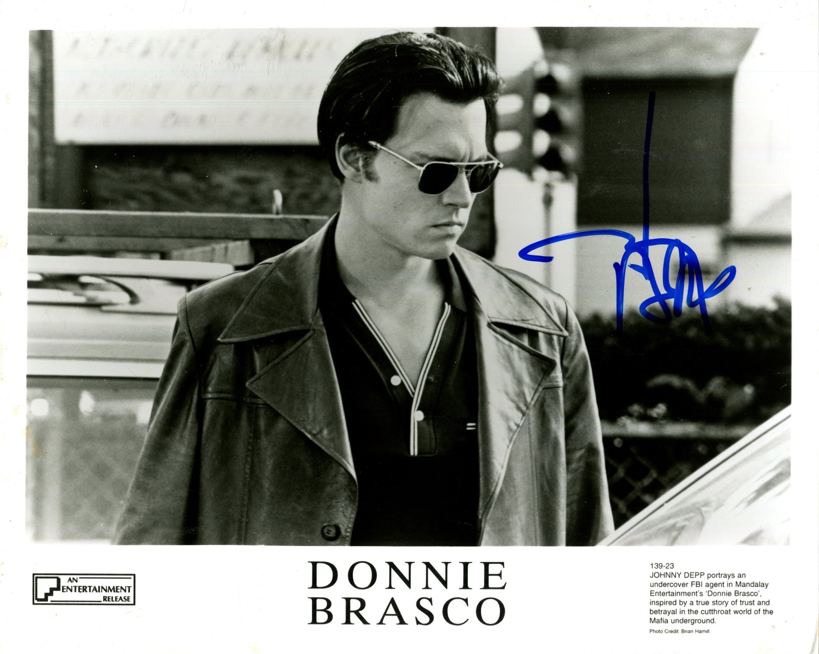 DEPP JOHNNY: (1963- ): DEPP JOHNNY: (1963- ) American actor. Signed 10 x 8 photograph of Depp standing outdoors in a half-length pose in costume as the undercover FBI Agent Joseph D. Pistone (Donnie Brasco) from the