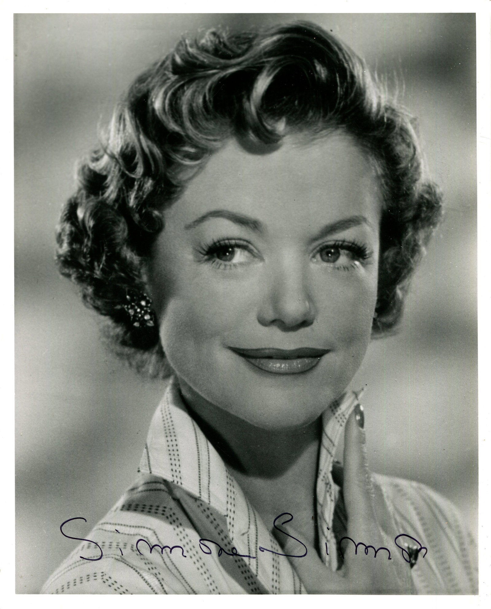 SIMON SIMONE: (1911-2005): SIMON SIMONE: (1911-2005) French actress, remembered for her role in the American supernatural horror film Cat People (1942). Signed 8 x 10 photograph of the actress in a smiling head and shoulders po