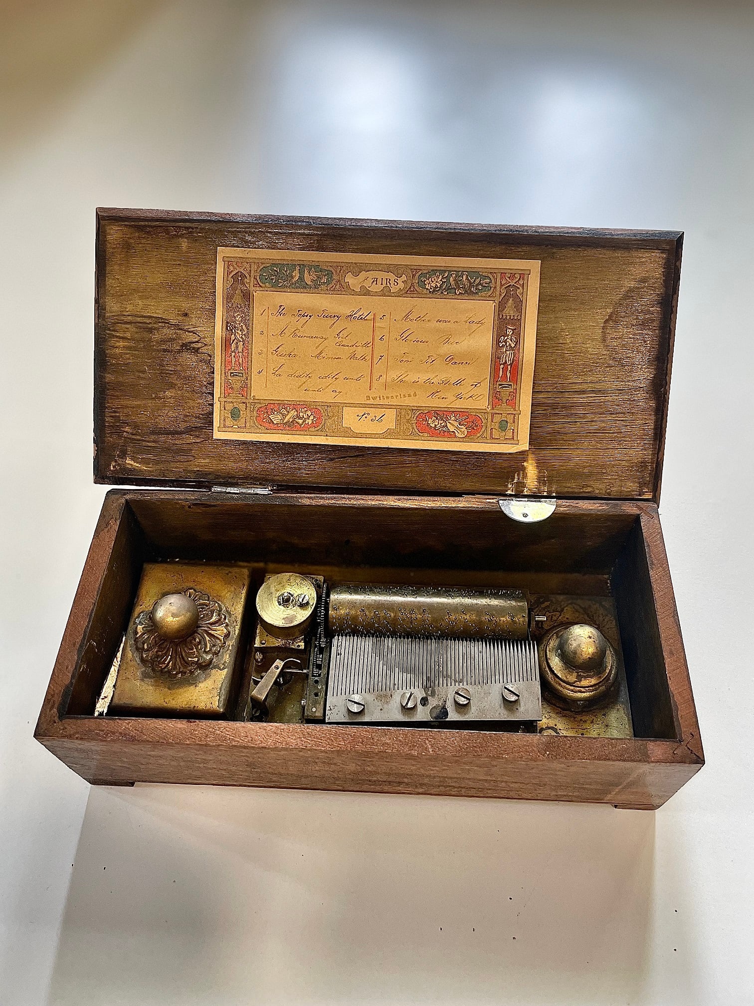MUSIC BOX:: MUSIC BOX: An attractive wooden music box (approximately 21 x 10, and 7 cm height), being the prop music box used in the American legal thriller film Music Box (1989) directed by Costa-Gavras and