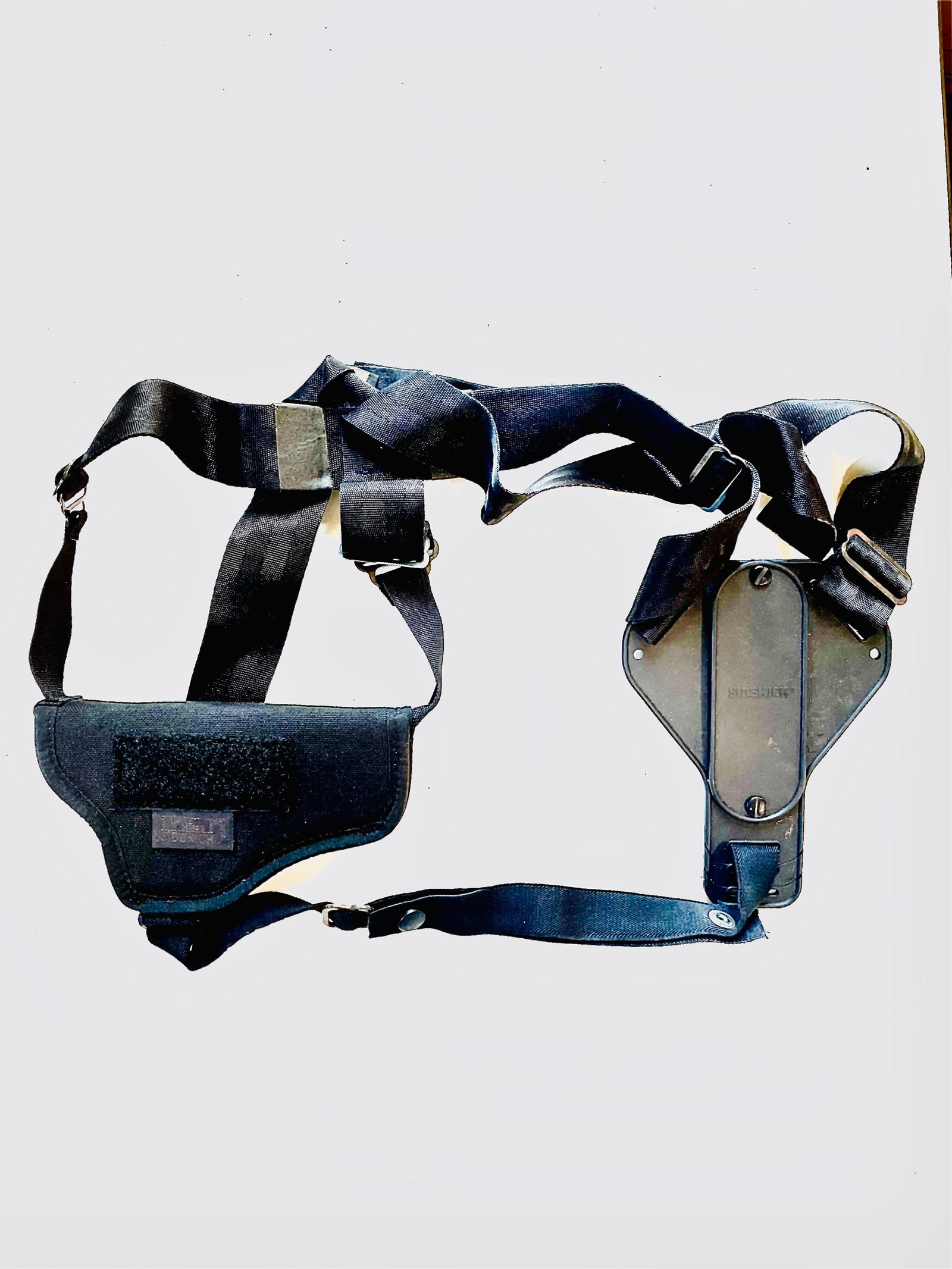[RESERVOIR DOGS]:: [RESERVOIR DOGS]: A Sidekick black shoulder holster worn by actor Tim Roth for his performance as Mr. Orange (Freddy Newendyke), a reputed drug dealer, in Quentin Tarantino´s cult American heist