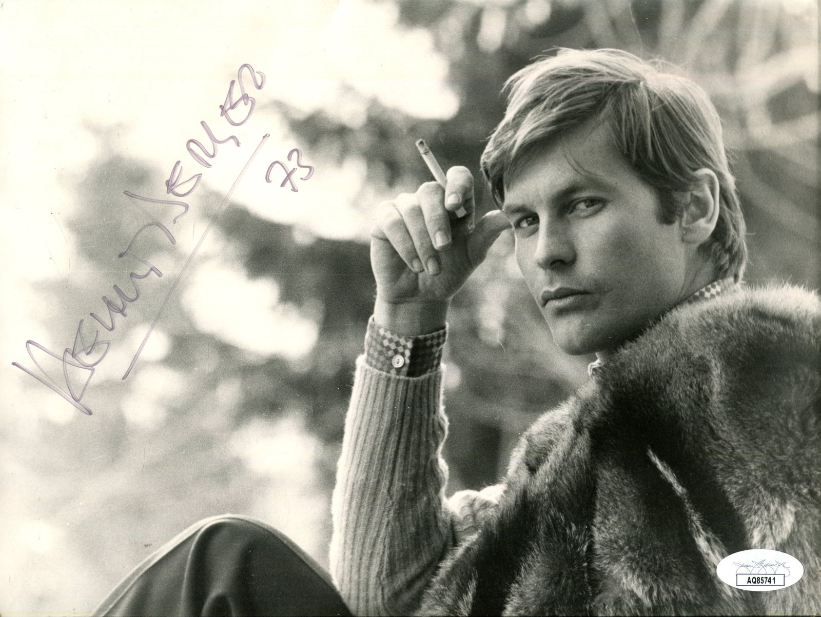 BERGER HELMUT: (1944-2023): BERGER HELMUT: (1944-2023) Austrian actor, a sex symbol and pop icon of the late 1960s and 1970s. Signed 9.5 x 7 photograph of Berger in an engaging head and shoulders pose holding a lit cigarette in
