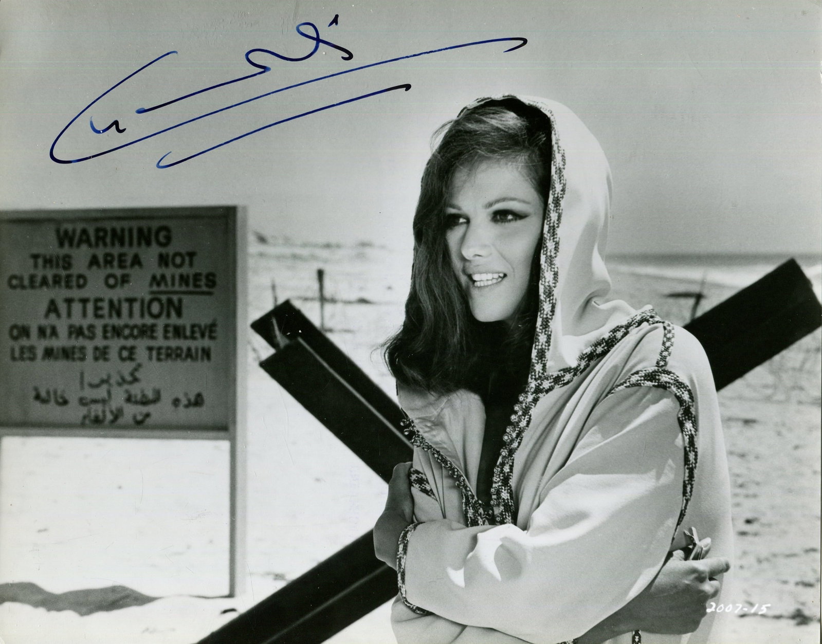 CARDINALE CLAUDIA: (1938-2025): CARDINALE CLAUDIA: (1938-2025) Tunisian-born Italian actress. Signed 9.5 x 7.5 photograph of Cardinale standing in a half-length pose in costume as Elena from the American drama film The Hell with Her