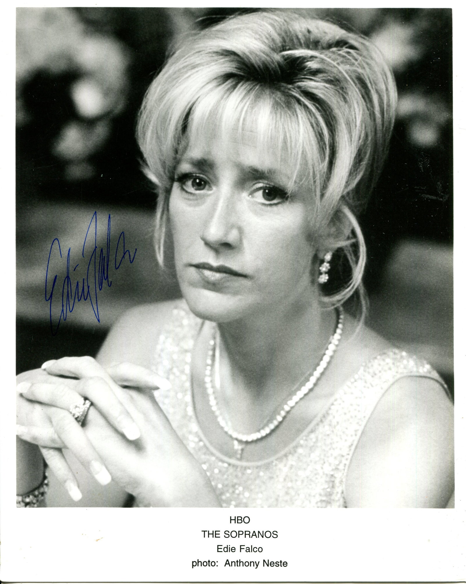 FALCO EDIE: (1963- ): FALCO EDIE: (1963- ) American actress. Signed 8 x 10 photograph of Falco in a head and shoulders pose in costume from one of her most famous roles as mob wife Carmela Soprano from the American crime