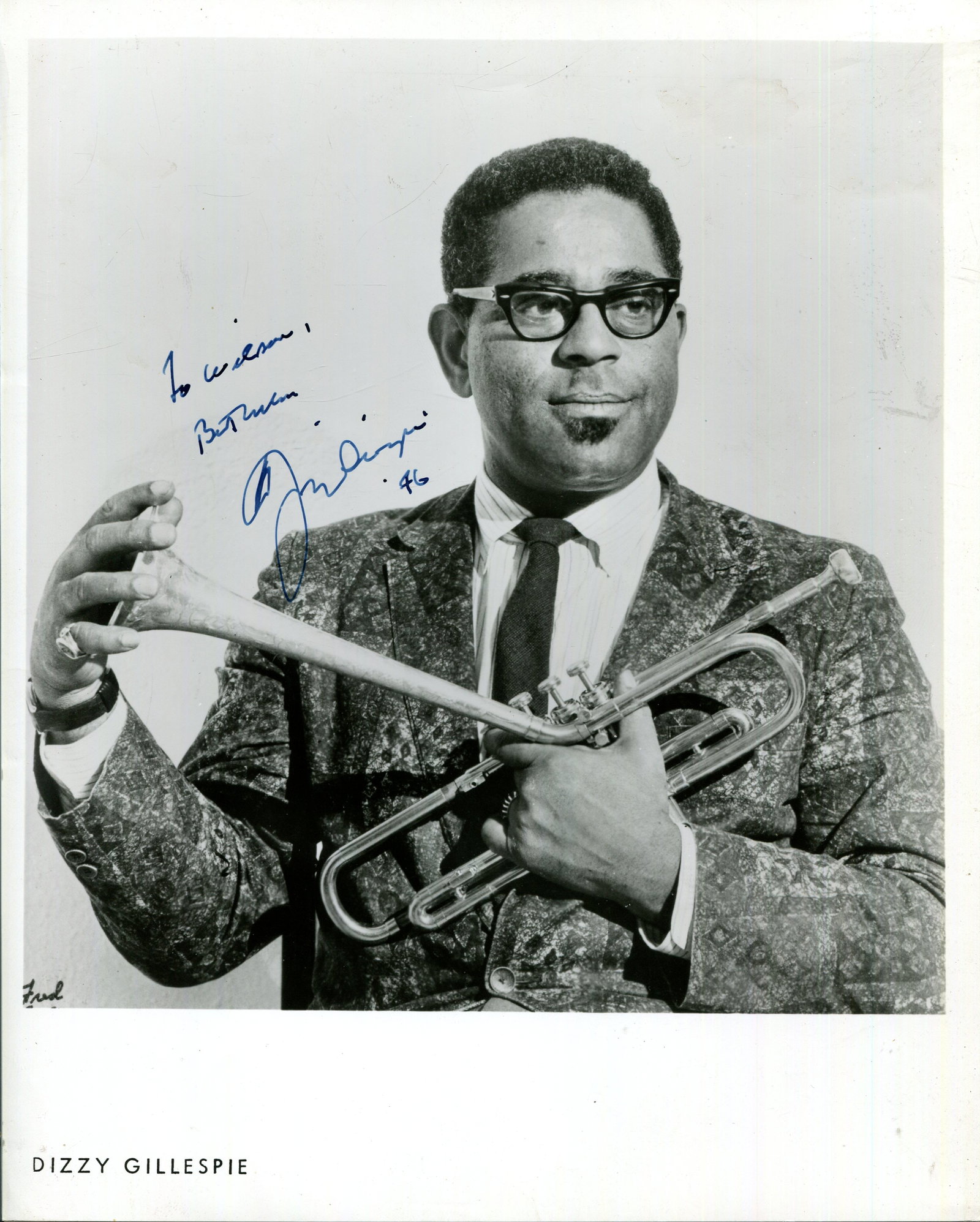 GILLESPIE DIZZY: (1917-1993): GILLESPIE DIZZY: (1917-1993) American jazz trumpeter. A good signed and inscribed 8 x 10 photograph of the musician standing in a half-length pose holding his distinctive bent trumpet. Signed in blue