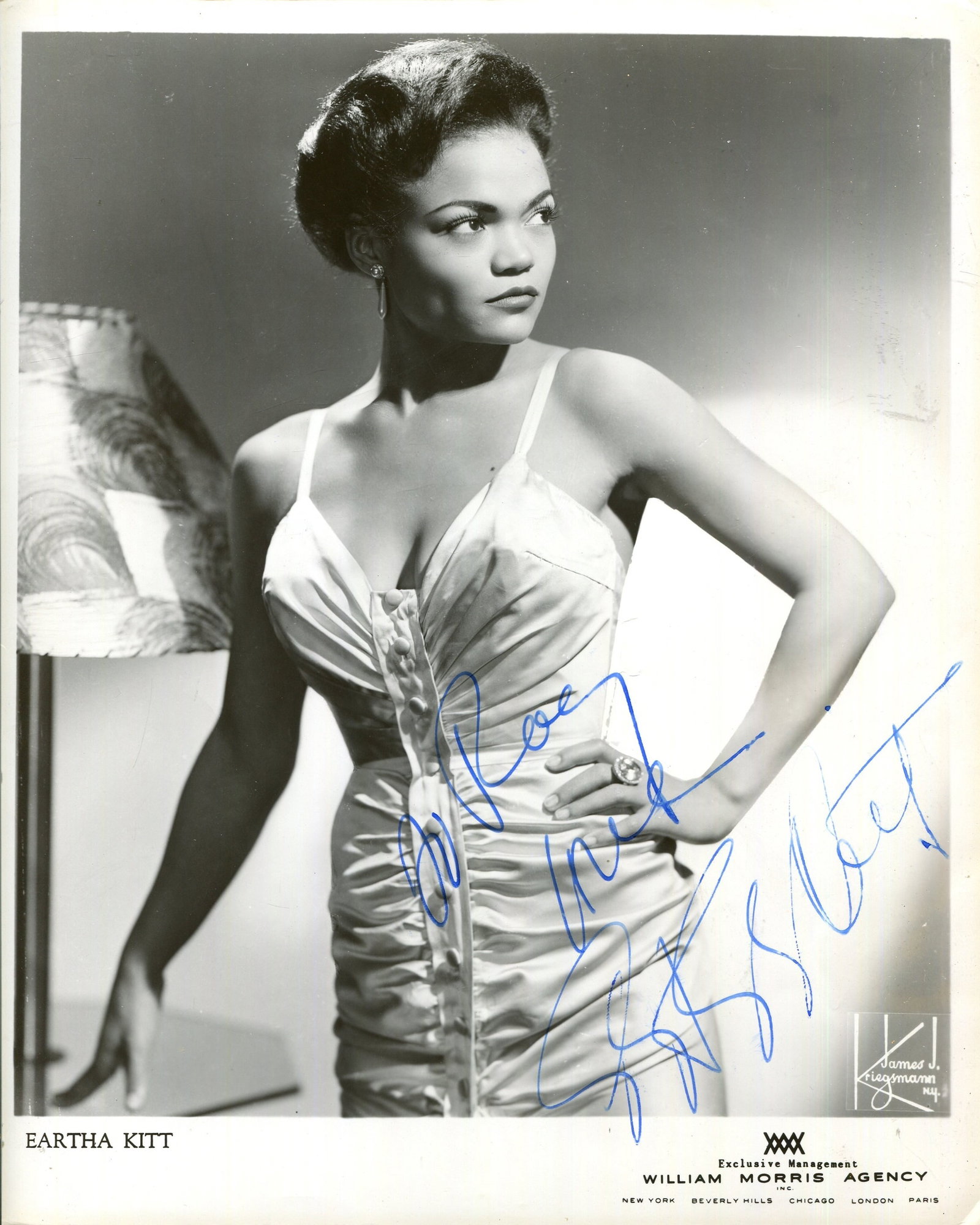 KITT EARTHA: (1927-2008): KITT EARTHA: (1927-2008) American singer and actress. A good vintage signed and inscribed 8 x 10 photograph of Kitt standing in a three-quarter length pose. Photograph by James J. Kriegsmann of New