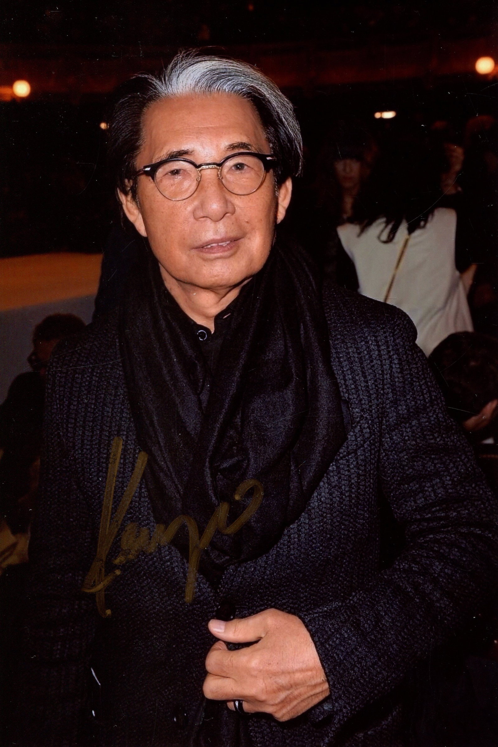 TAKADA KENZO: (1939-2020): TAKADA KENZO: (1939-2020) Japanese-French fashion designer. Signed colour 4 x 6 photograph of Takada standing in a candid half-length pose. Signed (´Kenzo´) with his first name only in gold