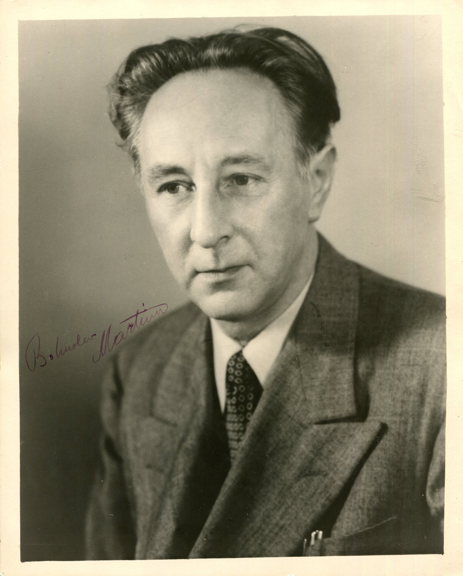 MARTINU BOHUSLAV: (1890-1959): MARTINU BOHUSLAV: (1890-1959) Czech composer of modern classical music. A fine vintage signed 8 x 10 photograph of Martinu in an engaging head and shoulders pose. Signed in fountain pen ink with his