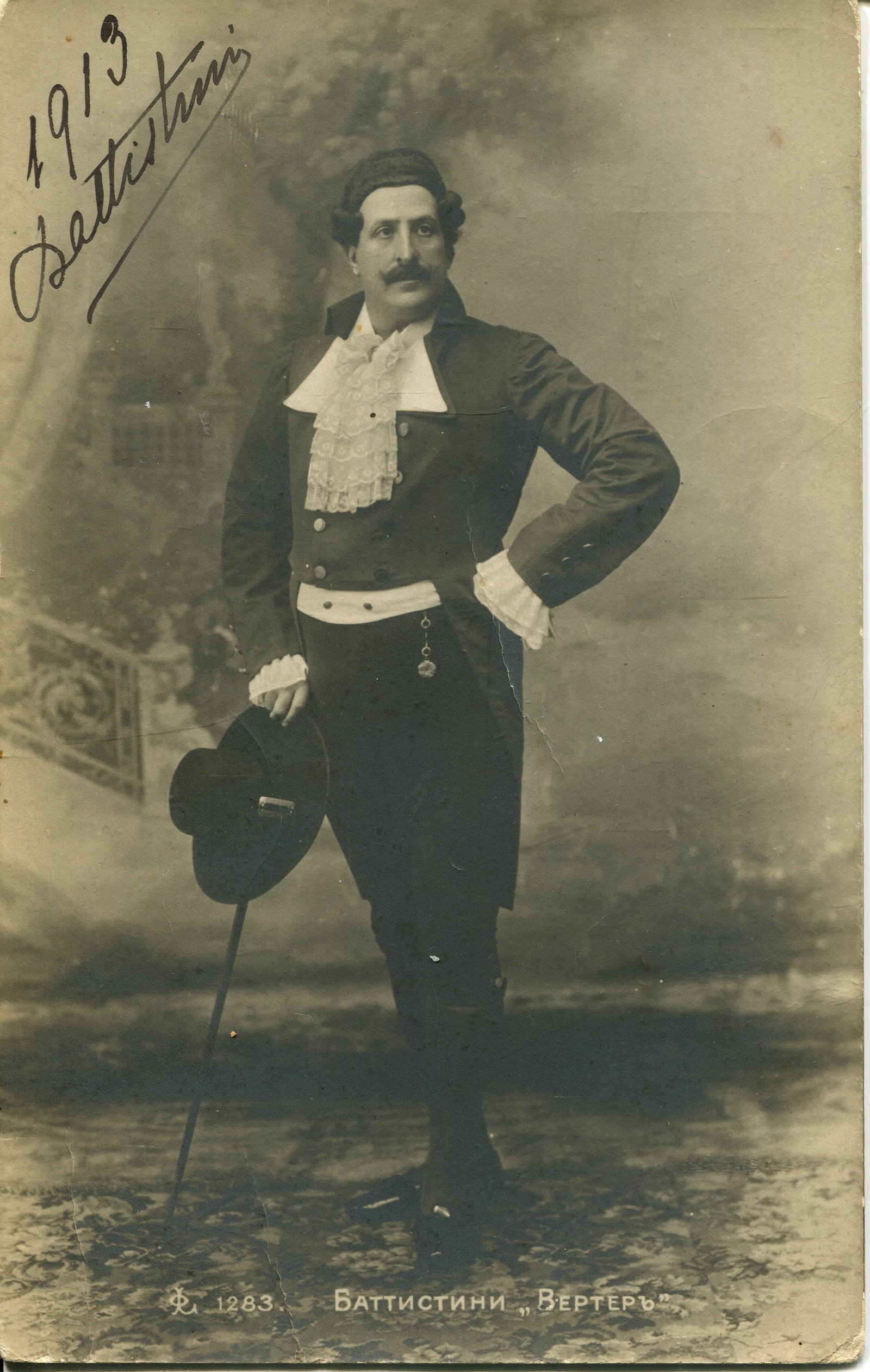 BATTISTINI MATTIA: (1856-1928): BATTISTINI MATTIA: (1856-1928) Italian baritone. Vintage signed postcard photograph of the singer standing in a full-length pose in costume as Werther from Jules Massenet´s four act opera