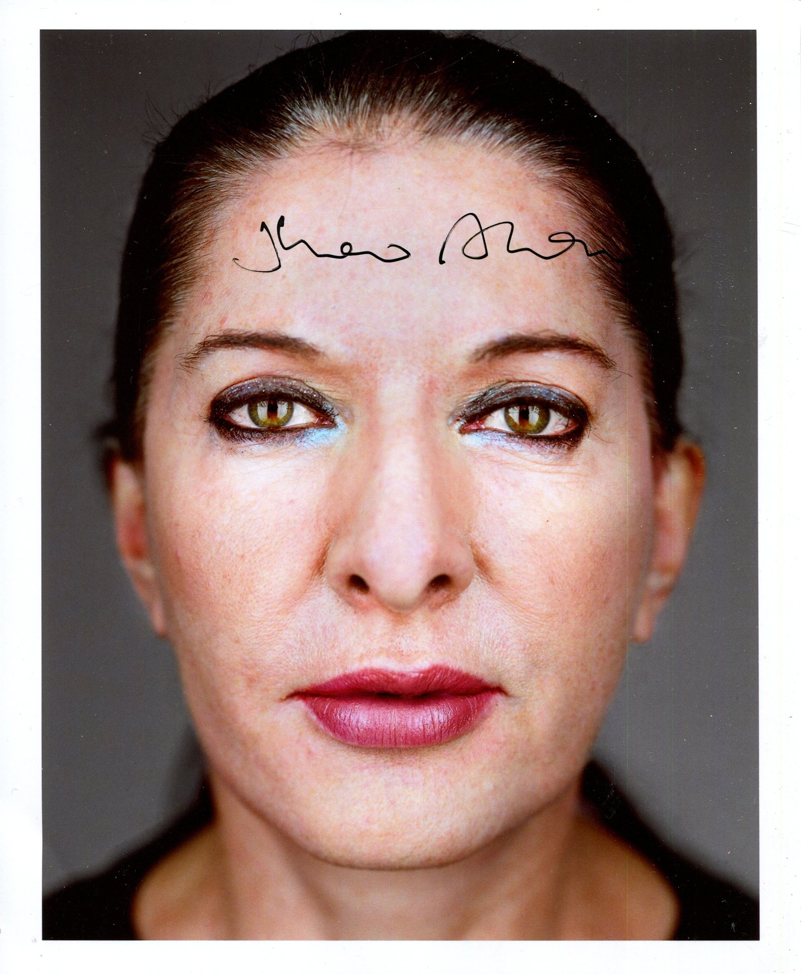 ABRAMOVIC MARINA: (1946- ): ABRAMOVIC MARINA: (1946- ) Serbian conecptual and performance artist. Signed 8 x 10 colour photograph of Abramovic, the image depicting the Serbian artist in a close-up portrait pose. Signed by