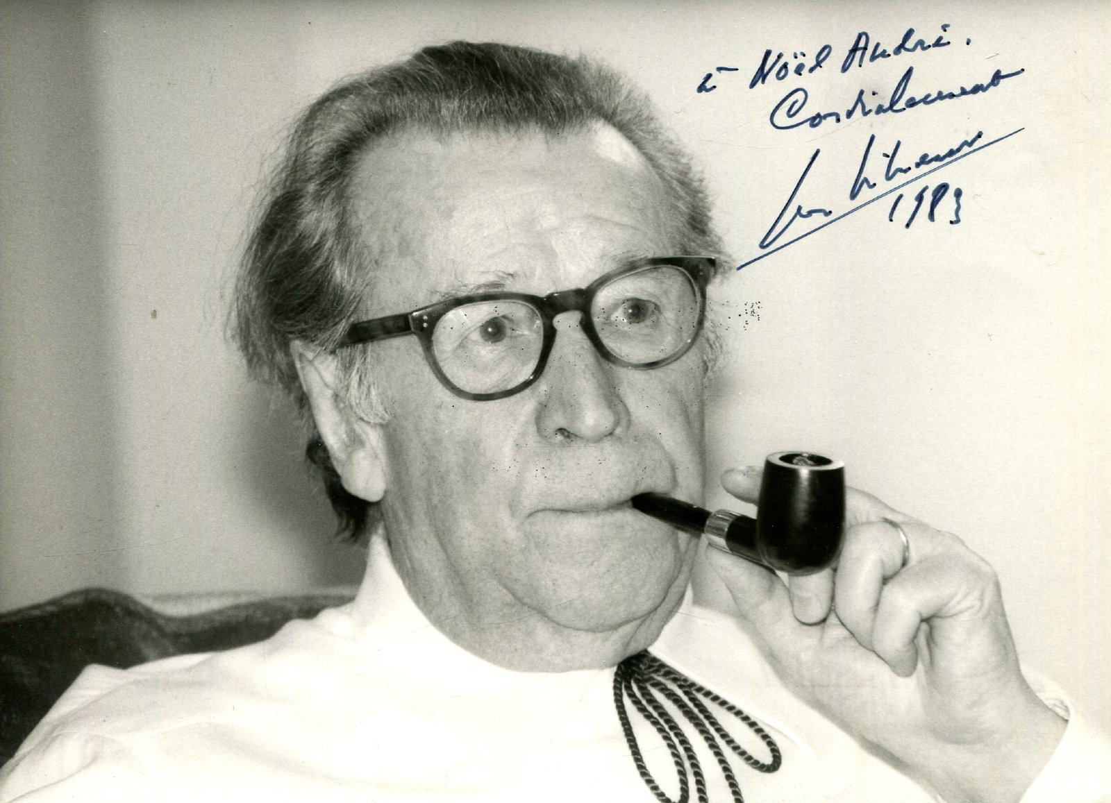 SIMENON GEORGES: (1903-1989): SIMENON GEORGES: (1903-1989) Belgian crime writer, creator of the fictional detective Jules Maigret. Signed and inscribed 6 x 4 photograph of the novelist in a head and shoulders pose smoking a pipe.