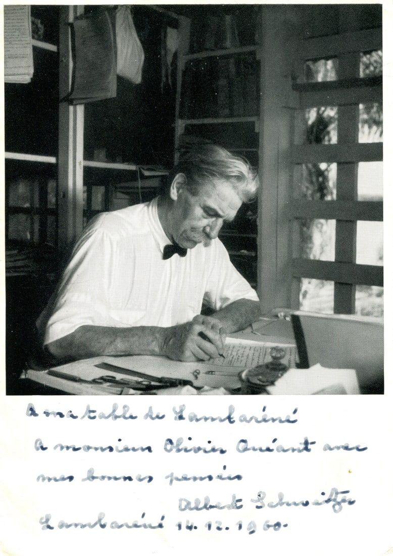 SCHWEITZER ALBERT: (1875-1965): SCHWEITZER ALBERT: (1875-1965) Alsatian theologian, musician, philosopher & physician, Nobel Peace Prize winner 1952. Vintage signed and inscribed 4 x 6 paperstock image of Schweitzer seated in a