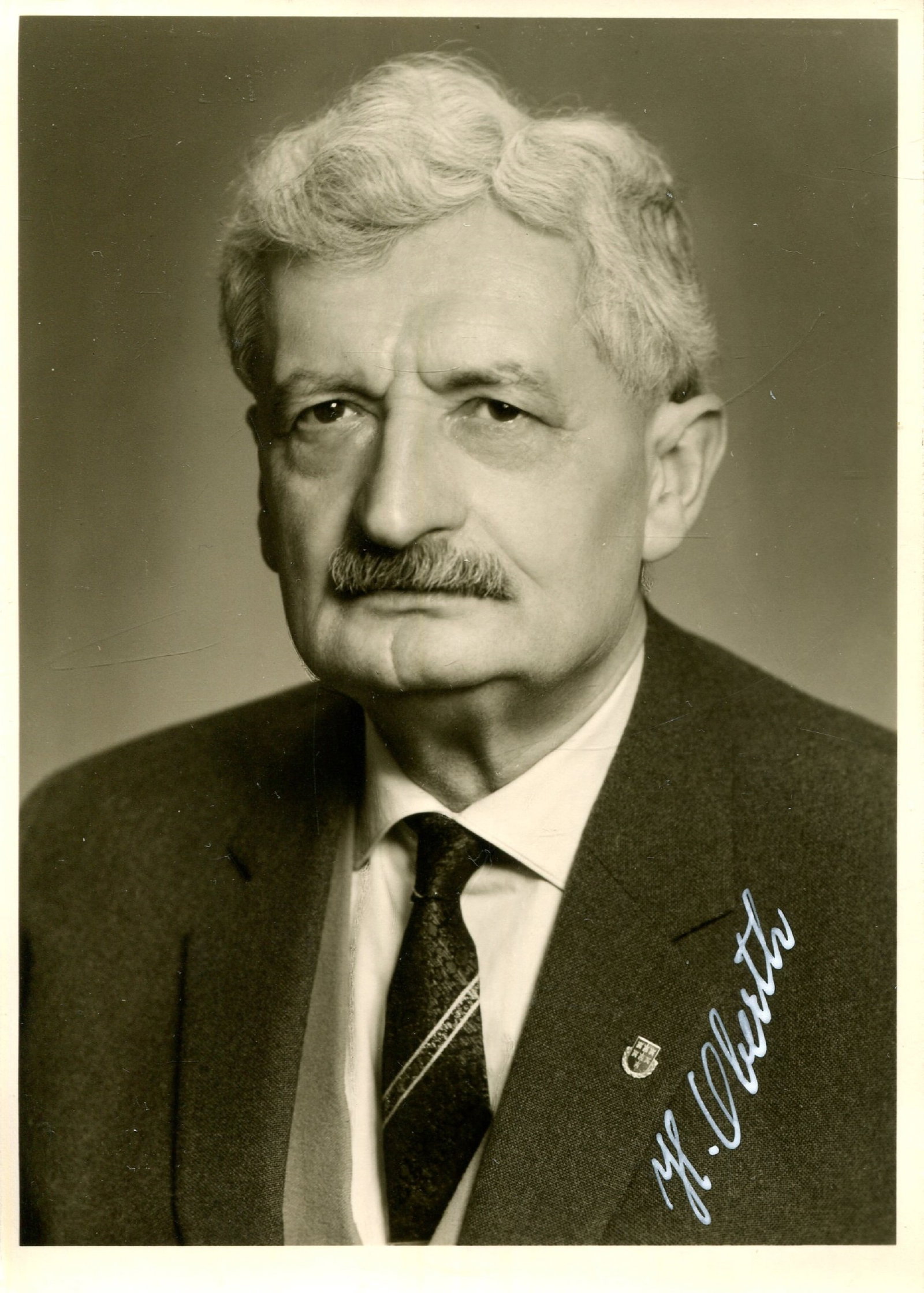 OBERTH HERMANN: (1894-1989) (x2): OBERTH HERMANN: (1894-1989) German physicist, one of the founding founders of rocketry and astronautics. Signed 4 x 6 postcard photograph of Oberth in a head and shoulders pose. Photograph by Richard
