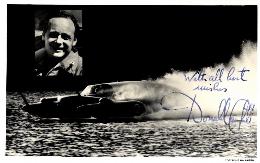 CAMPBELL DONALD: (1921-1967) British Car & Motorboat Ra: CAMPBELL DONALD: (1921-1967) British Car & Motorboat Racer, World Land and Water Speed Record Holder in the 1950s and 1960s. Vintage signed postcard photograph, the image depicting the Blue Bird trave