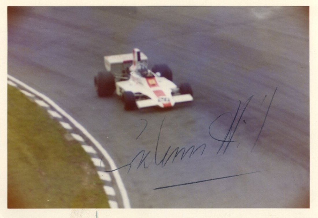 HILL GRAHAM: (1929-1975) English Motor Racing Driver, F: HILL GRAHAM: (1929-1975) English Motor Racing Driver, Formula One World Champion 1962 & 1968. Vintage signed colour 5 x 3.5 photograph depicting Hill driving a racing car around a circuit. Signed in i