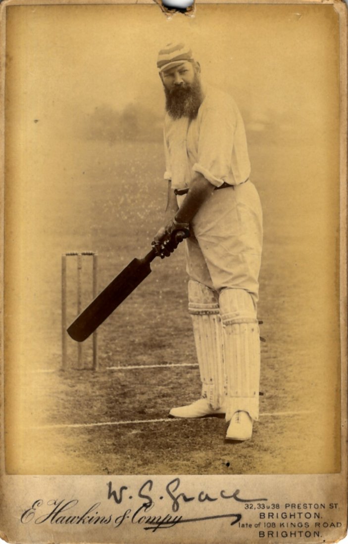 GRACE W. G.: (1848-1915) English Cricketer. A good: GRACE W. G.: (1848-1915) English Cricketer. A good vintage signed sepia cabinet photograph of Grace standing in a full length pose at the crease, holding his cricket bat. Photograph by E. Hawkins & Co