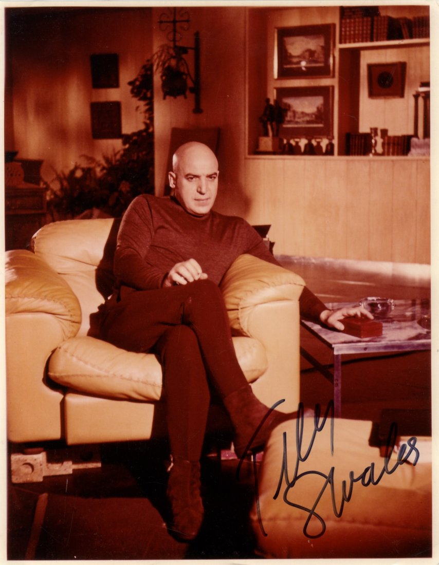 SAVALAS TELLY: (1922-1994) American Actor. A good: SAVALAS TELLY: (1922-1994) American Actor. A good signed colour 8 x 10 photograph of Savalas seated in a full length pose in costume as Ernst Stavro Blofeld in a scene from the James Bond film On Her