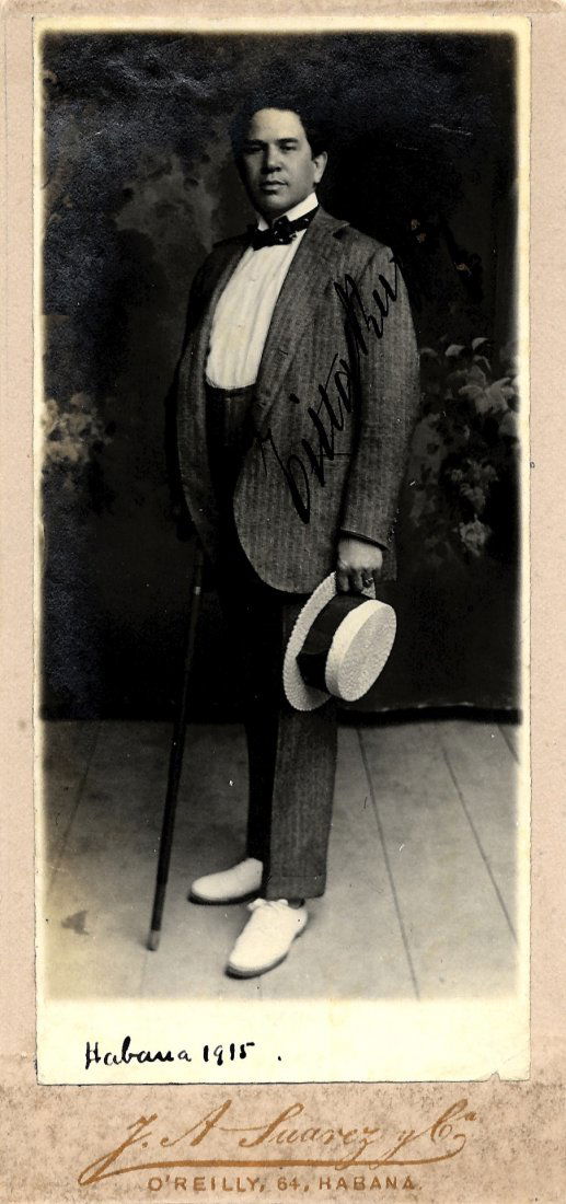 RUFFO TITTA: (1877-1953) Italian Baritone. Vintage: RUFFO TITTA: (1877-1953) Italian Baritone. Vintage signed 3 x 6.5 'cabinet' photograph of the dapper Ruffo standing in a full length pose. Photograph by J. A. Suarez & Co of Havana. Signed by Ruffo in