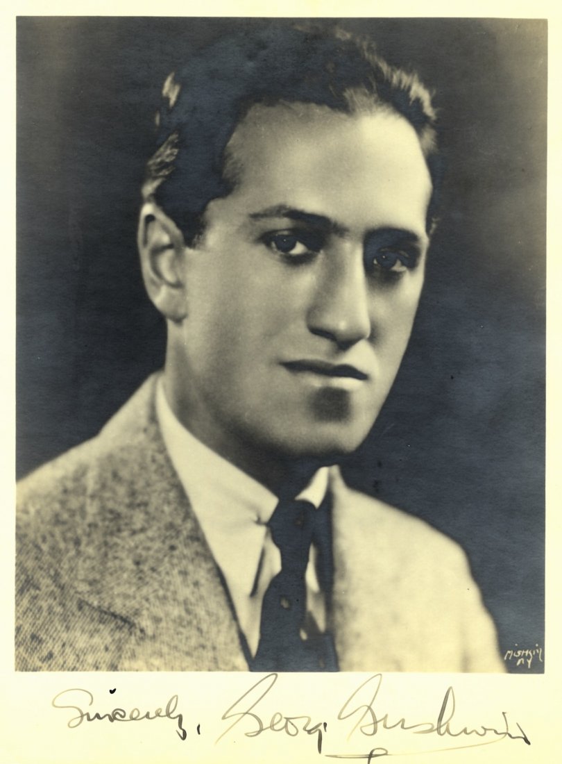 GERSHWIN GEORGE: (1898-1937) American Composer &: GERSHWIN GEORGE: (1898-1937) American Composer & Pianist. A good vintage signed 8 x 10 photograph of Gershwin in a head and shoulders pose. Photograph by Mishkin of New York. Signed ('Sincerely, Georg