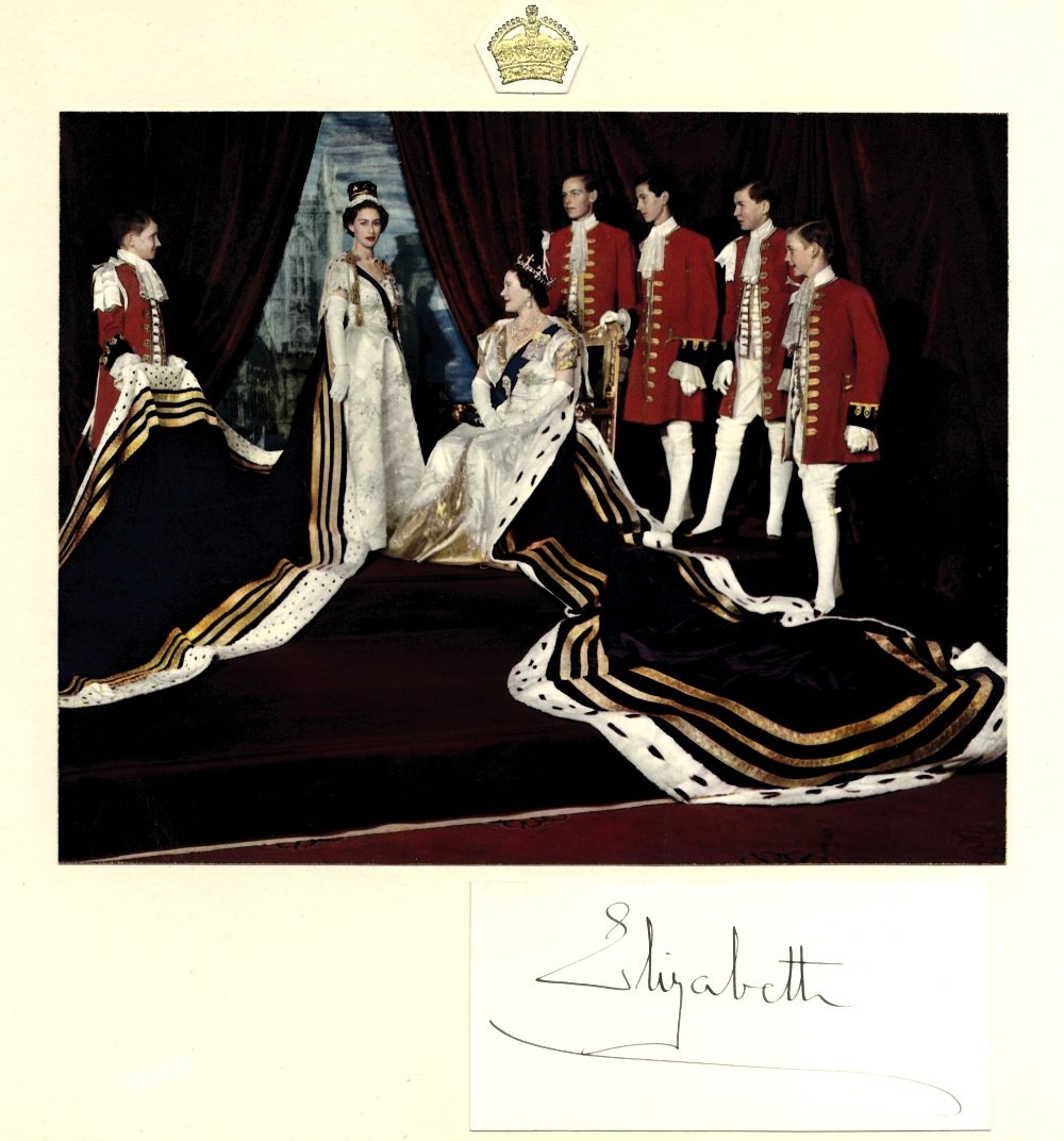 ELIZABETH THE QUEEN MOTHER: (1900-2002) Queen Consort: ELIZABETH THE QUEEN MOTHER: (1900-2002) Queen Consort of King George VI. Dark fountain pen ink signature ('Elizabeth') on a card, neatly laid down beneath a colour image of the Queen Mother seated in