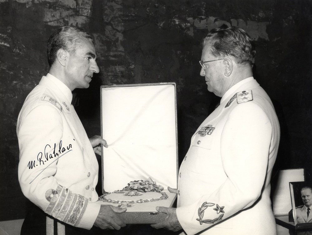 PAHLAVI MOHAMMED REZA: (1919-1980) Shah of Iran: PAHLAVI MOHAMMED REZA: (1919-1980) Shah of Iran 1941-79. Vintage signed 10 x 7.5 photograph, the image depicting the Shah standing in a profile half length pose opposite Josip Broz Tito. Both men are