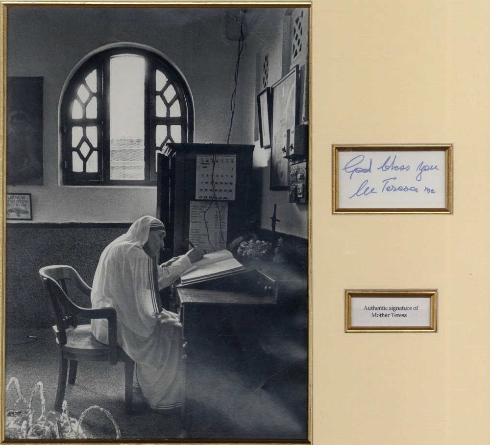 TERESA MOTHER: (1910-1997) Albanian Roman Catholic Nun,: TERESA MOTHER: (1910-1997) Albanian Roman Catholic Nun, Nobel Peace Prize winner, 1979. Bold blue ink signature ('God bless you, M Teresa MC') on an oblong 12mo white card, matted in ivory with gold c