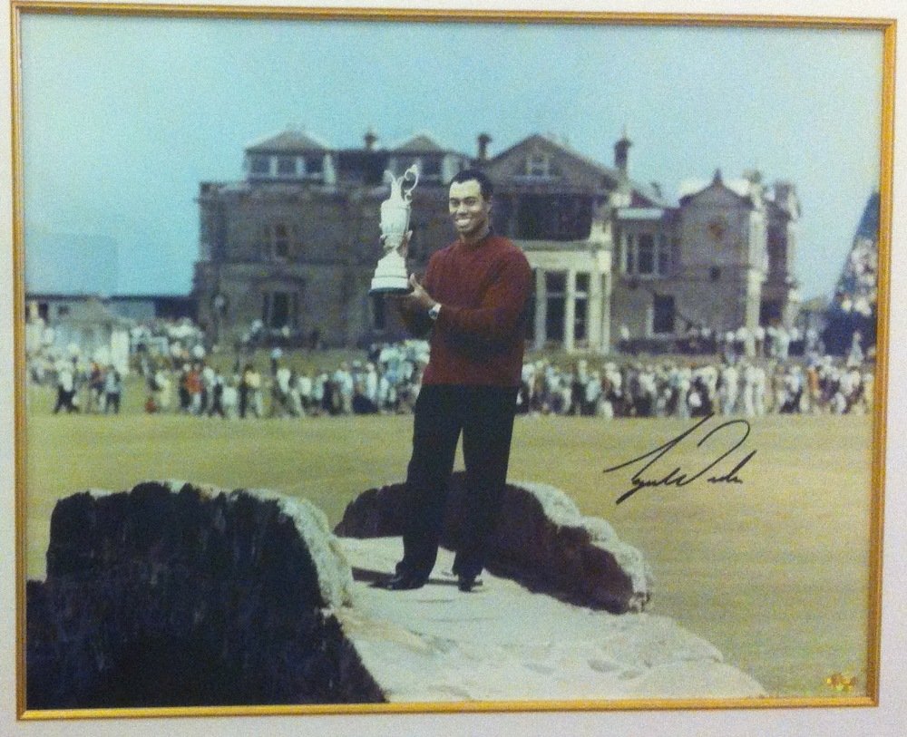 WOODS TIGER: (1975- ) American Golfer, Open: WOODS TIGER: (1975- ) American Golfer, Open Championship winner 2000, 2005 & 2006. A good, large signed colour 19 x 15 photograph of Woods standing in a full length pose, holding the Claret Jug trophy