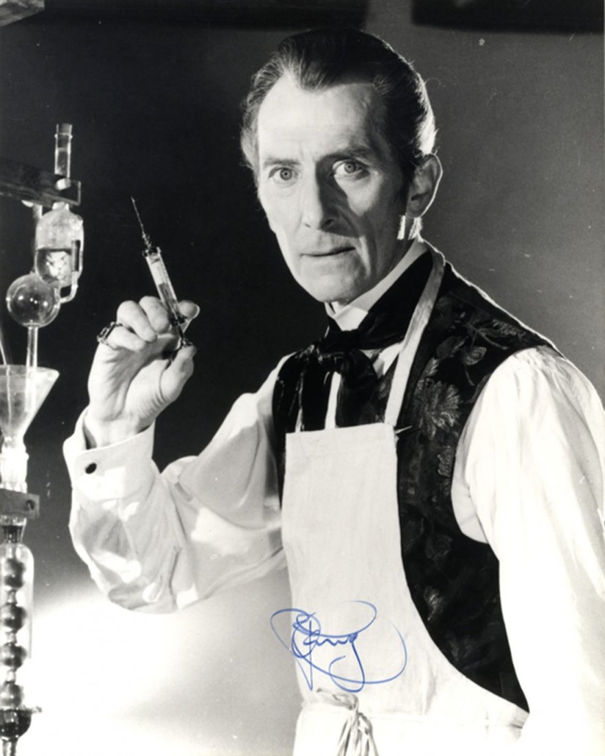 CUSHING PETER: (1913-1994) English Actor. Signed 8 x 10: CUSHING PETER: (1913-1994) English Actor. Signed 8 x 10 photograph of Cushing standing in a half length pose, in costume as Baron Victor Frankenstein, holding a syringe in one hand, from the Hammer Ho