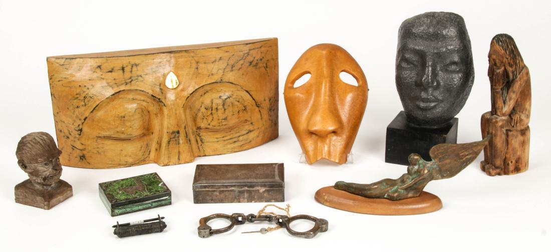 10 pc Decorator Group Lot: 10 pc Decorator Group Lot, including a James Caudle hammered lead mask on stand, several wood carvings, an ethnographic mask, 2 jewelry boxes, a Chinese lock, handcuff and a metal winged statue. Rangi