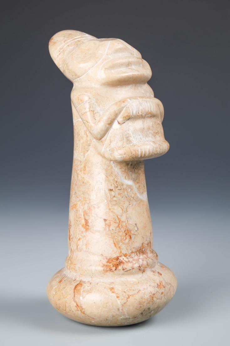 Taino Pestle (1000-1500 CE): Taino Pestle (1000-1500 CE). Full anthropic figure. Made from a variegated marble. Size: 7.5'' x 3.5'' x 4'' (19 x 9 x 10 cm). Provenance: Larry Roberts, author of Taino Sculpture: Art of the Gods.