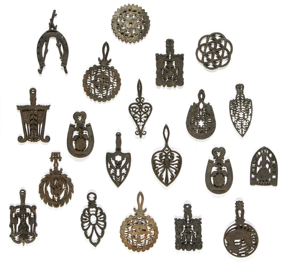 20 Antique Cast Iron Trivets: 20 Antique Cast Iron Trivets. Largest Size: 9.5'' x 6'' (24 x 15 cm).