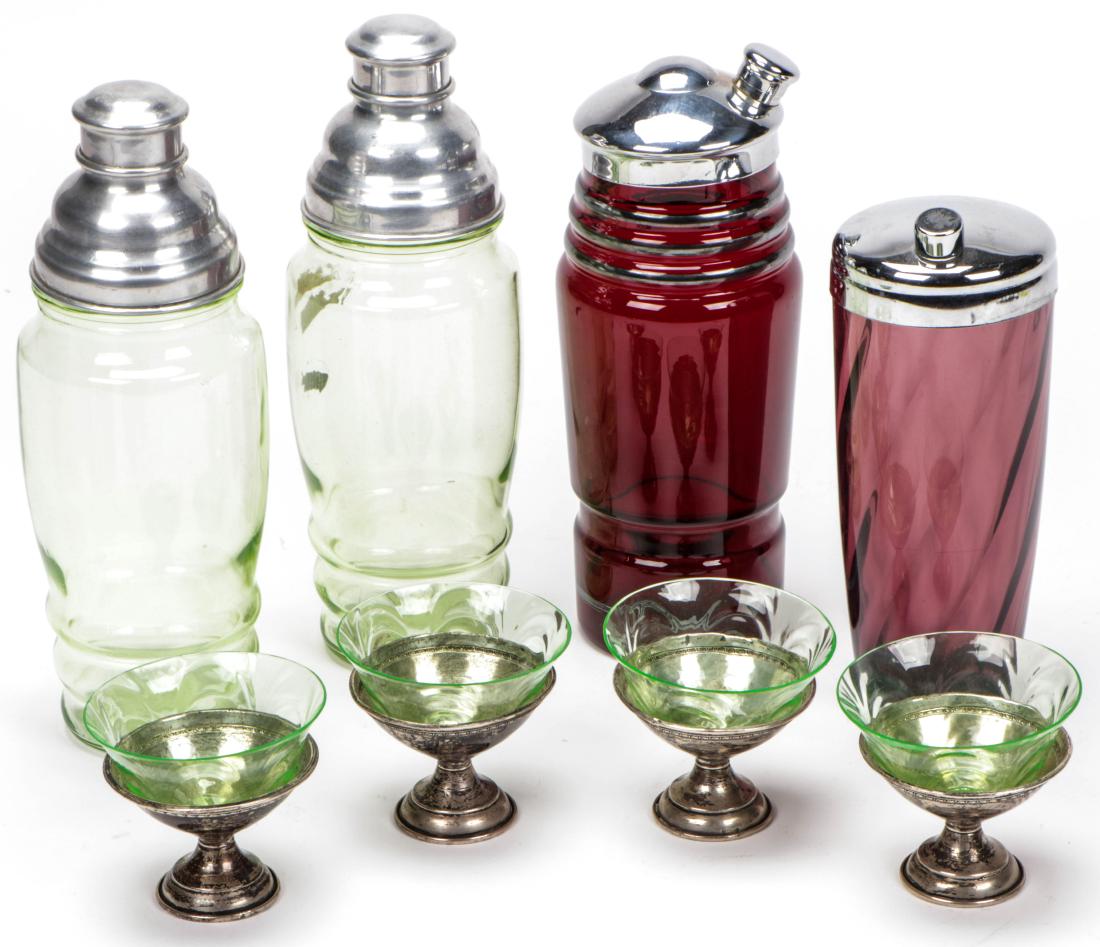 4 Machine Age Cocktail Shakers, 4 Complimentary Glasses: 4 Machine Age Barware Group including 2 Uranium Glass Cocktail Shakers, with 4 Complimentary Glasses and 2 Ruby Glass Cocktail Shakers. Ranging in size from: 11.5'' x 3.75'' x 3.75'' (29 x 10 x 10 cm)