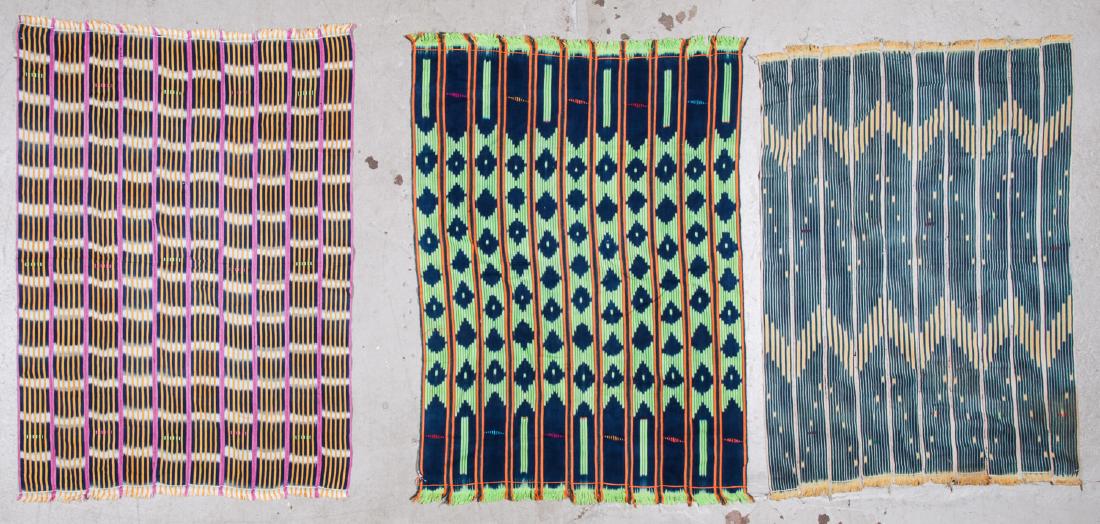 3 Vintage West African Indigo Cloths: 3 Vintage West African Indigo Cloths: handspun cotton, narrow strip loom. Largest size: 56'' x 41.75'' (142 x 106 cm). Note: This is a NO RESERVE auction. Bidding on all lots will start at $50.