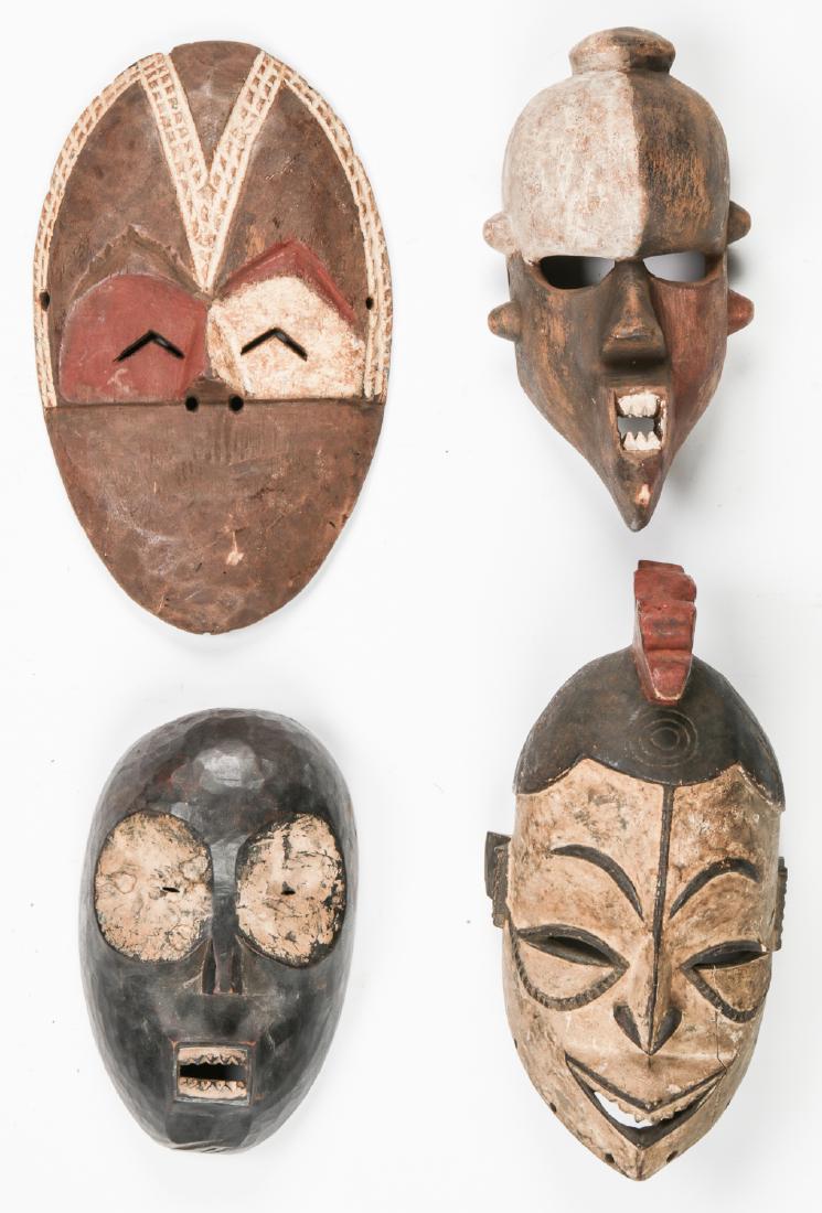 4 African Masks: 4 African Masks, each carved and painted wood, inlcluding Pende. Largest size: 10.5'' x 7.75'' x 8'' (27 x 20 x 20 cm). Note: This is a NO RESERVE auction. Bidding on all lots will start at $50.