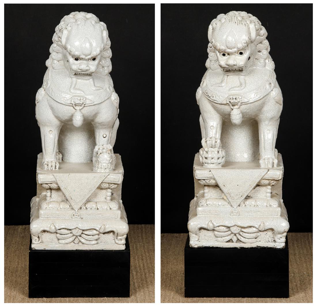 Pair of Large Chinese Ceramic Guardian Lions/Foo Dogs: Pair of Large Chinese Ceramic Guardian Lions/Foo Dogs. Largest size: 38'' x 13.5'' x 17'' (97 x 34 x 43 cm).