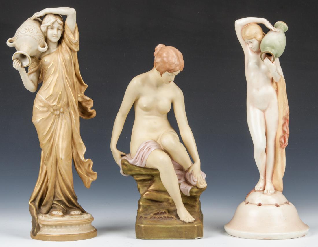 3 Bohemian Art Nouveau Porcelain Statuettes: 3 Bohemian Art Nouveau Porcelain Statuettes, including 2 marked Royal Dux and 1 by an unknown maker. Largest size: 13.75'' x 4.5'' x 4'' (35 x 11 x 10 cm). Provenance: Ex. Michael Lawrence Collection,