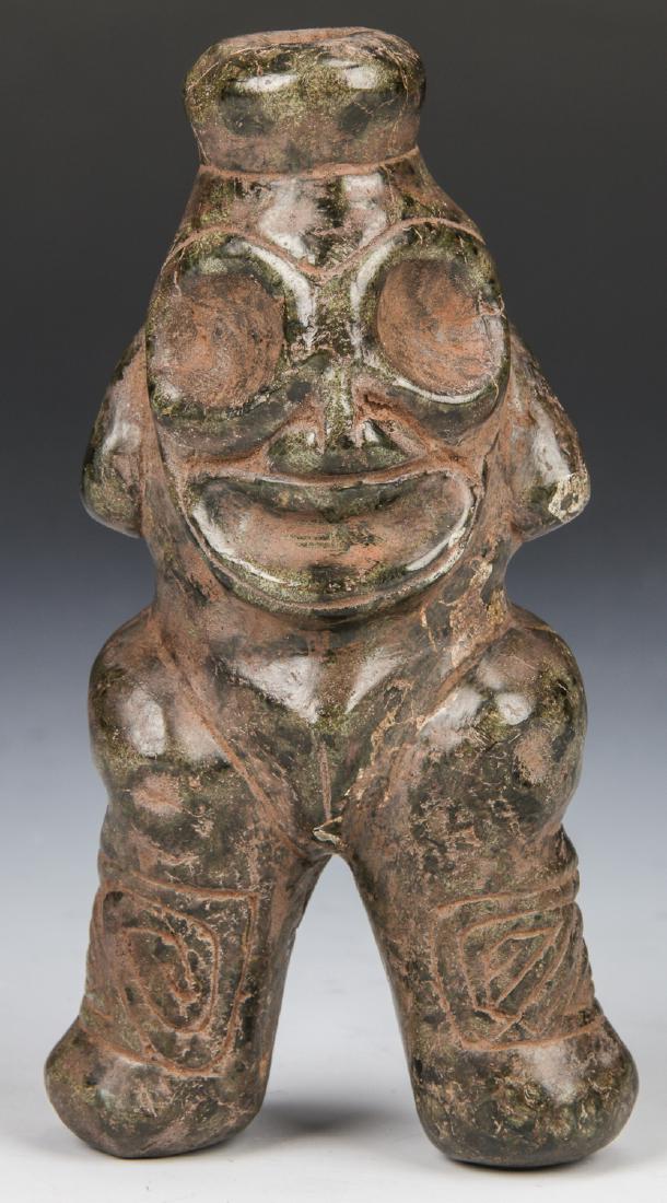 Taino Female Anthropic Cohoba Inhaler (c. 1000-1500AD): Taino Female Anthropic Cohoba Inhaler (c. 1000-1500AD). Graphic Raised and swollen vagina indicate reception to fertility. Hands rest behind head as if reclining. A greeting smile engages the viewer, 