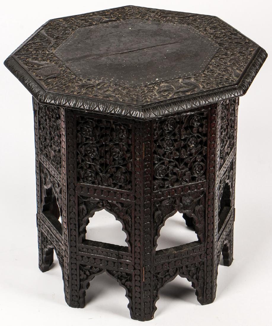 Antique Carved Ironwood Octagonal Table, India: Antique Carved Ironwood Octagonal Table, India. Rich, heavy wood intricately decorated with foliate forms in Mughal style. Provenance: Philadelphia Museum of Art. Proceeds to be used towards purchase 