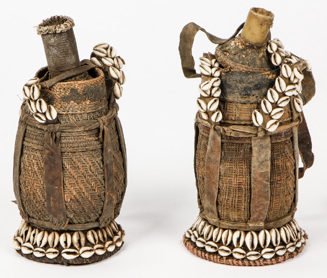 2 Old Ethiopian Medicine Jars: 2 Old Ethiopian Medicine Jars with Cowrie Shells. Largest Size: 11'' x 6'' (28 x 15 cm).